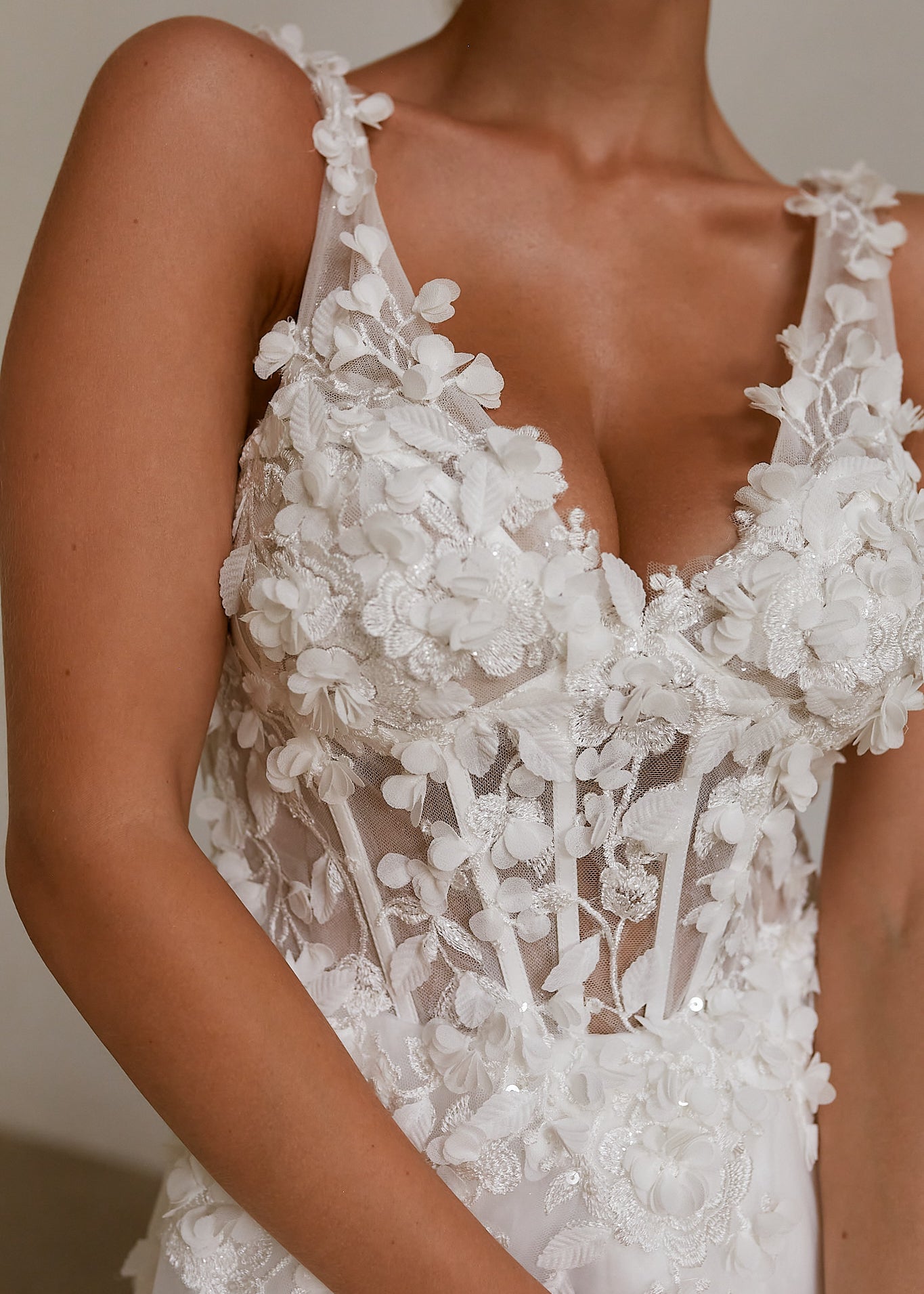 Detail close up shot of a bride wearing a Floral A-Line Wedding Dress in a bright room