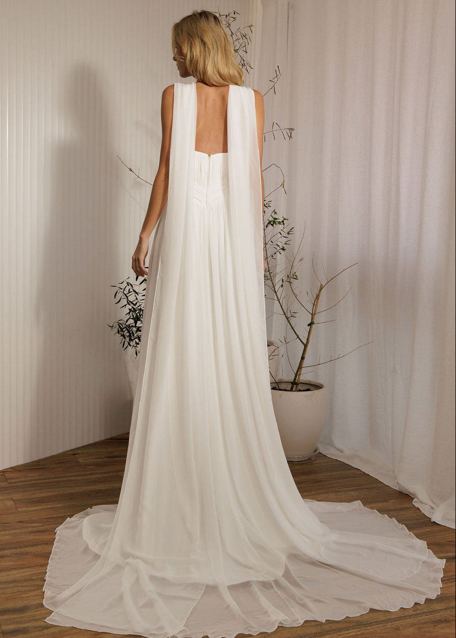 Ophelia romantic wedding dress back view with flowing chiffon cape and soft train