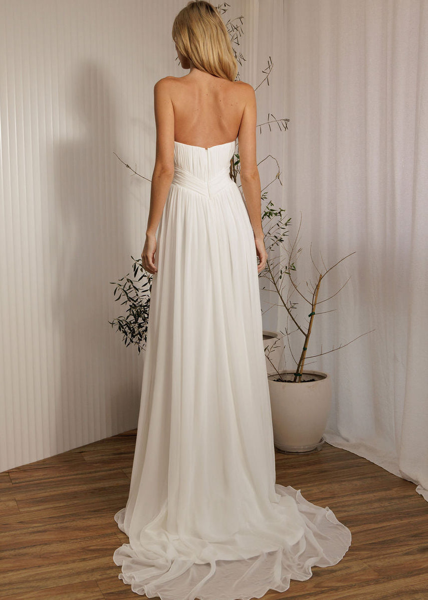 Ophelia designer romantic chiffon wedding dress back view with flowing skirt
