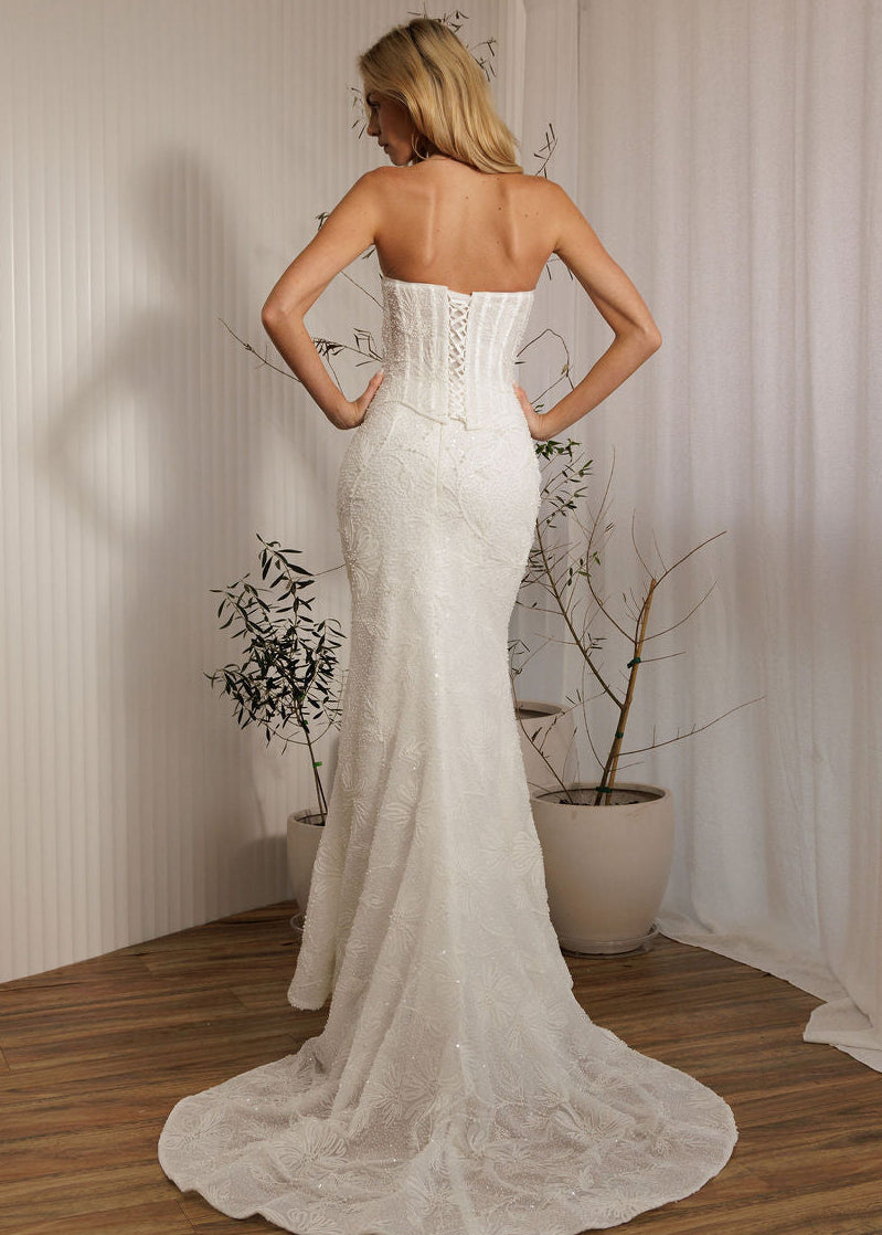 Back view of Prague beaded crepe fit-and-flare wedding dress with lace-up corset bodice and train