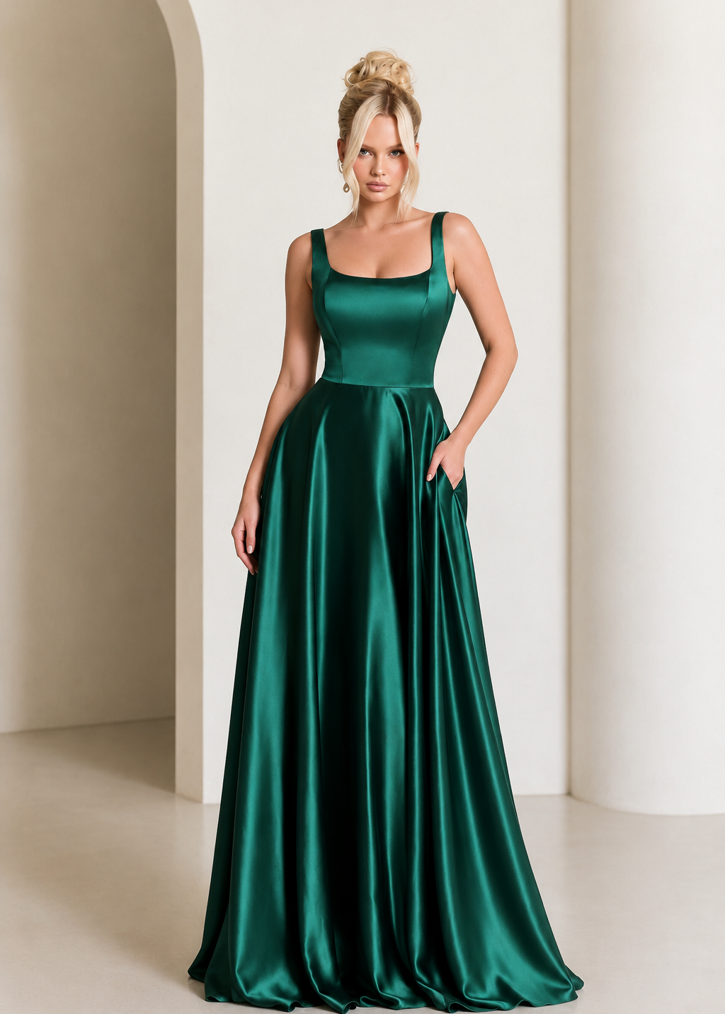 Woman wearing a green satin dress against a neutral background