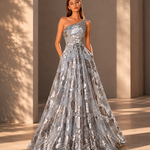 Woman wearing a silver sequin gown against a neutral background