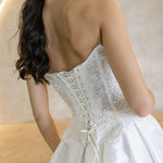 Viena satin A-line wedding dress back detail with lace corset bodice and lace-up closure.