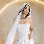 Viena satin A-line wedding dress with lace corset bodice and strapless neckline.