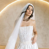 Viena satin A-line wedding dress with lace corset bodice and strapless neckline.