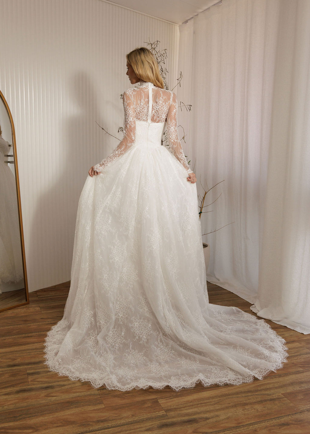 Back view of Vivaldi lace A-line wedding dress with detachable lace bodysuit and full lace skirt train