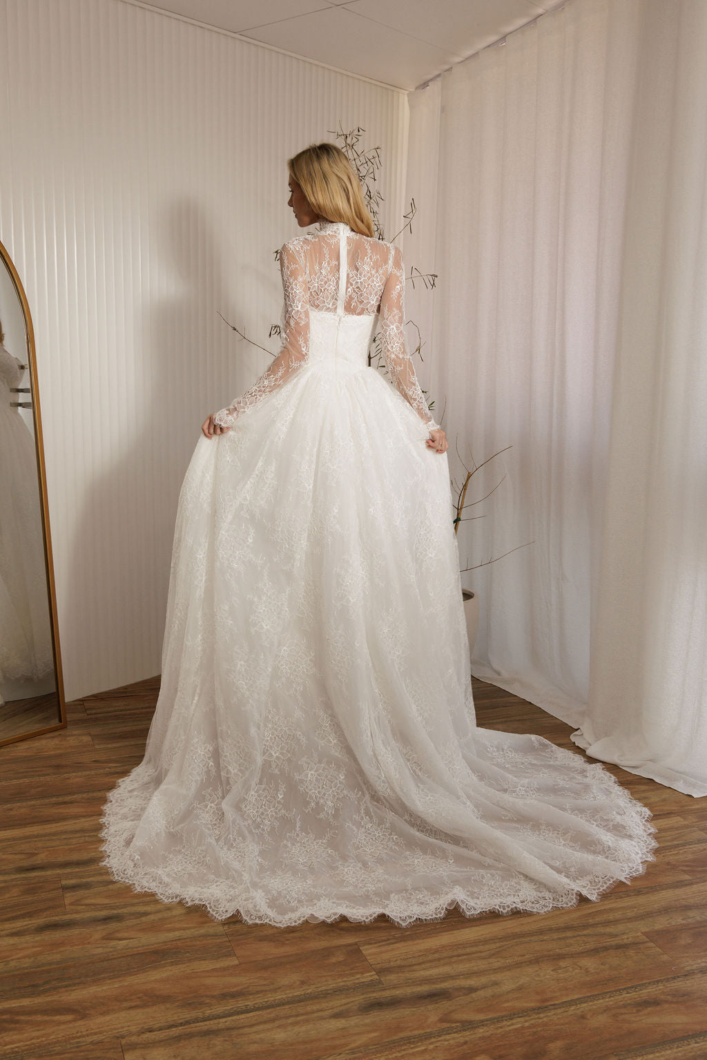 Back view of Vivaldi lace A-line wedding dress with detachable lace bodysuit and full lace skirt train
