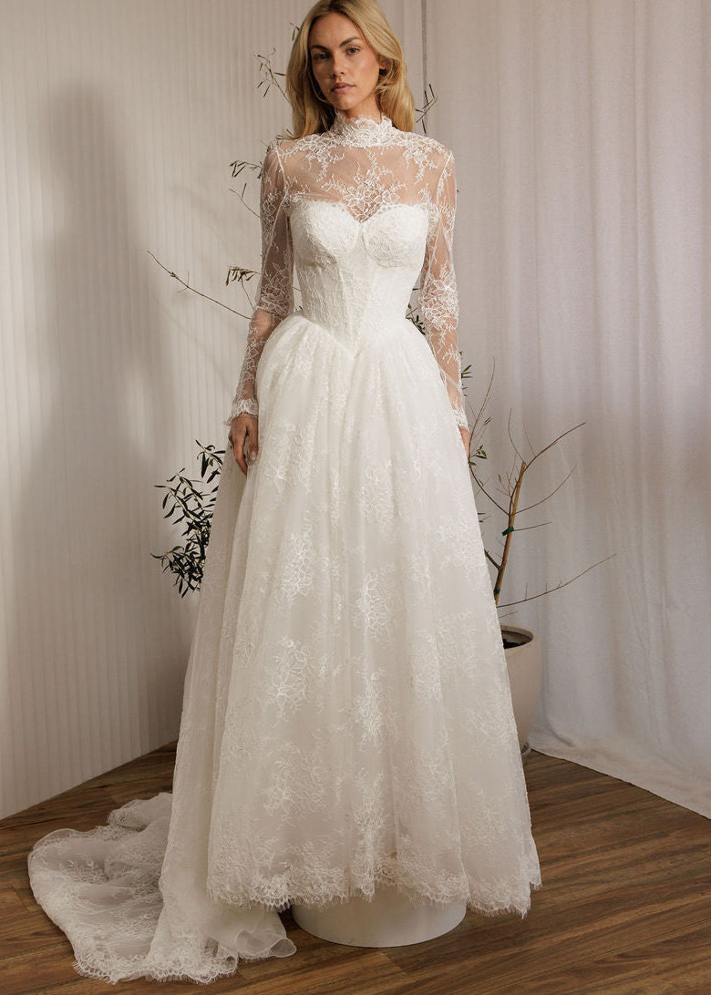 Detachable lace bodysuit over Vivaldi lace A-line wedding dress with Basque waist bodice and full lace skirt