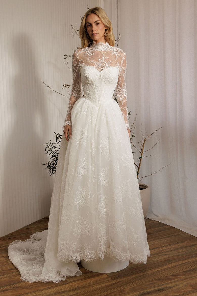 Detachable lace bodysuit over Vivaldi lace A-line wedding dress with Basque waist bodice and full lace skirt