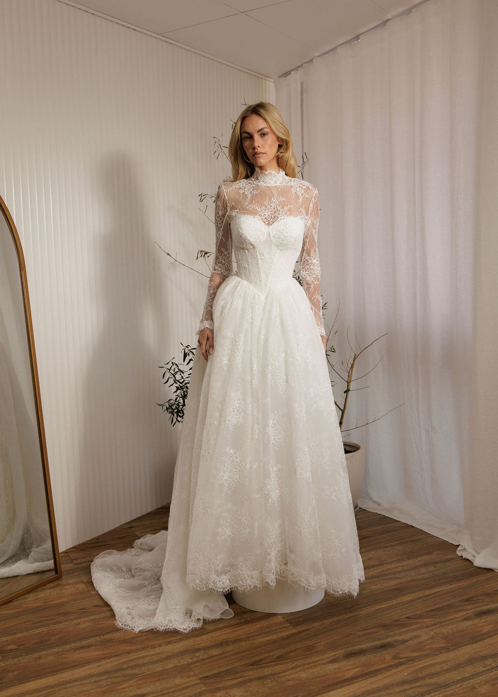 Detachable lace bodysuit over Vivaldi lace A-line wedding dress with Basque waist bodice and full lace skirt