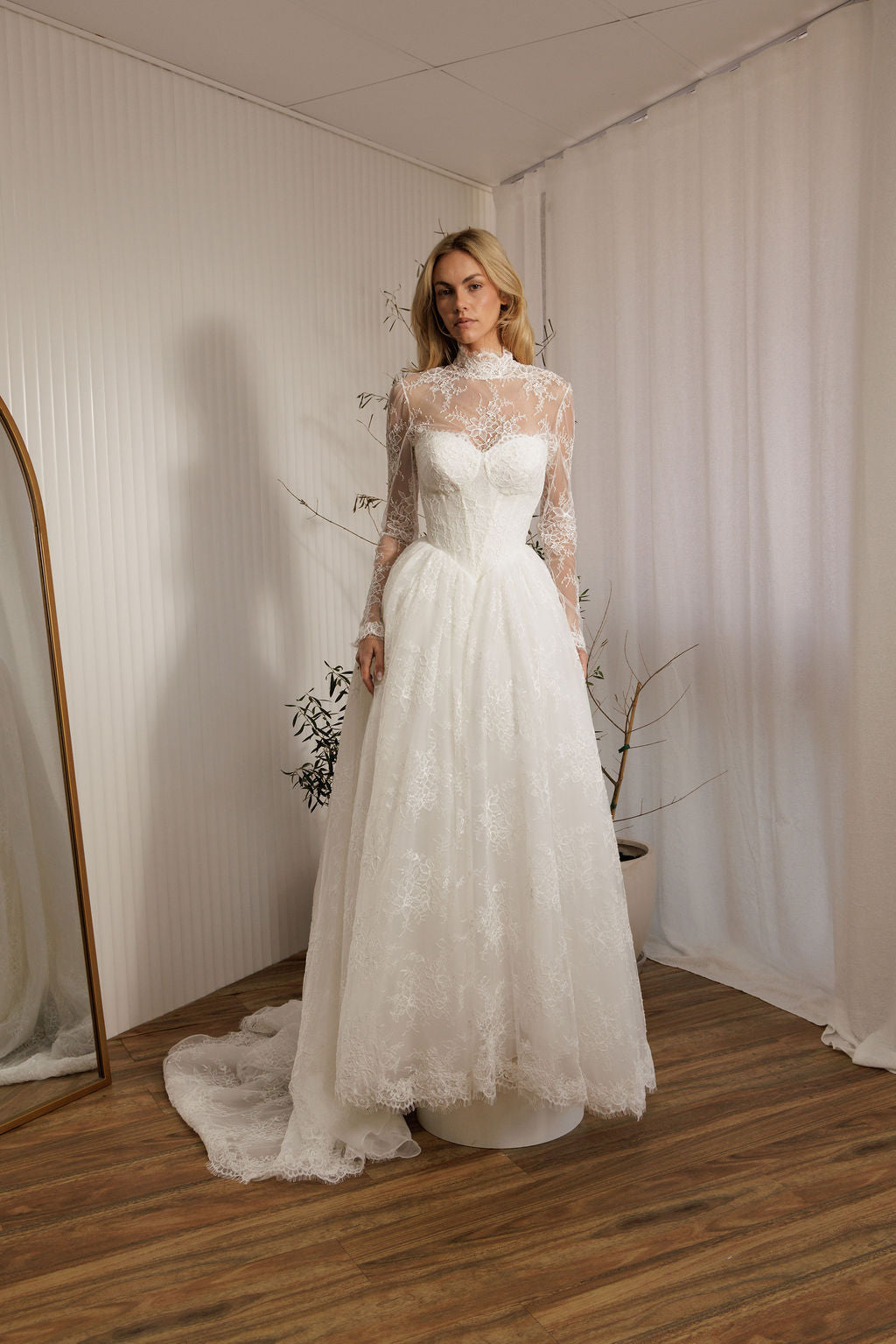 Detachable lace bodysuit over Vivaldi lace A-line wedding dress with Basque waist bodice and full lace skirt