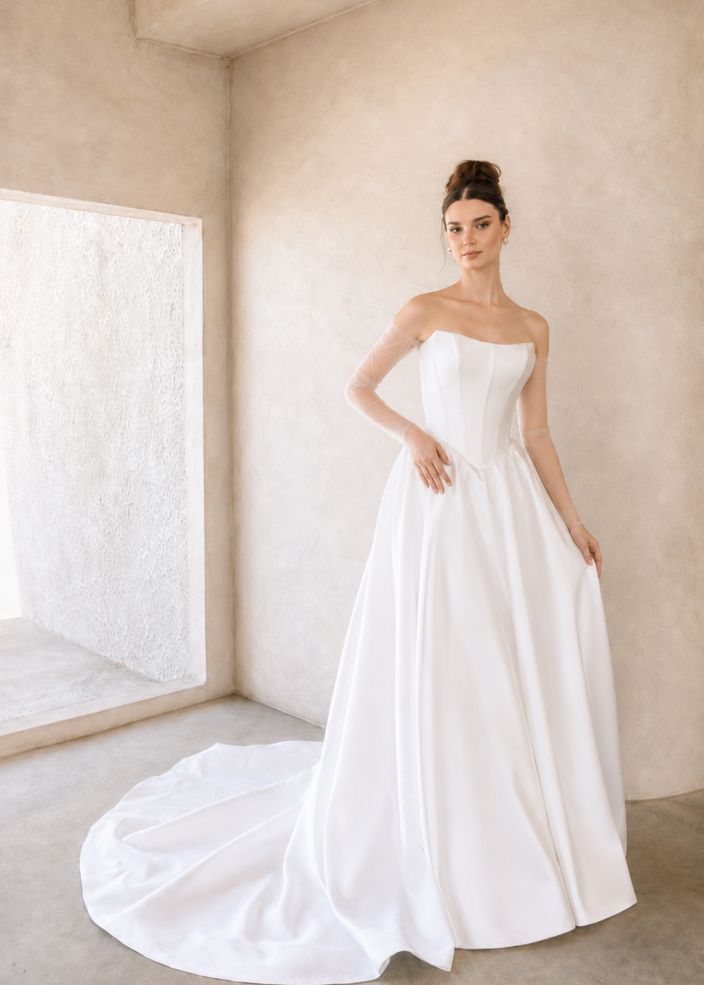 Woman wearing a modern mikado wedding dress in a minimalistic room.