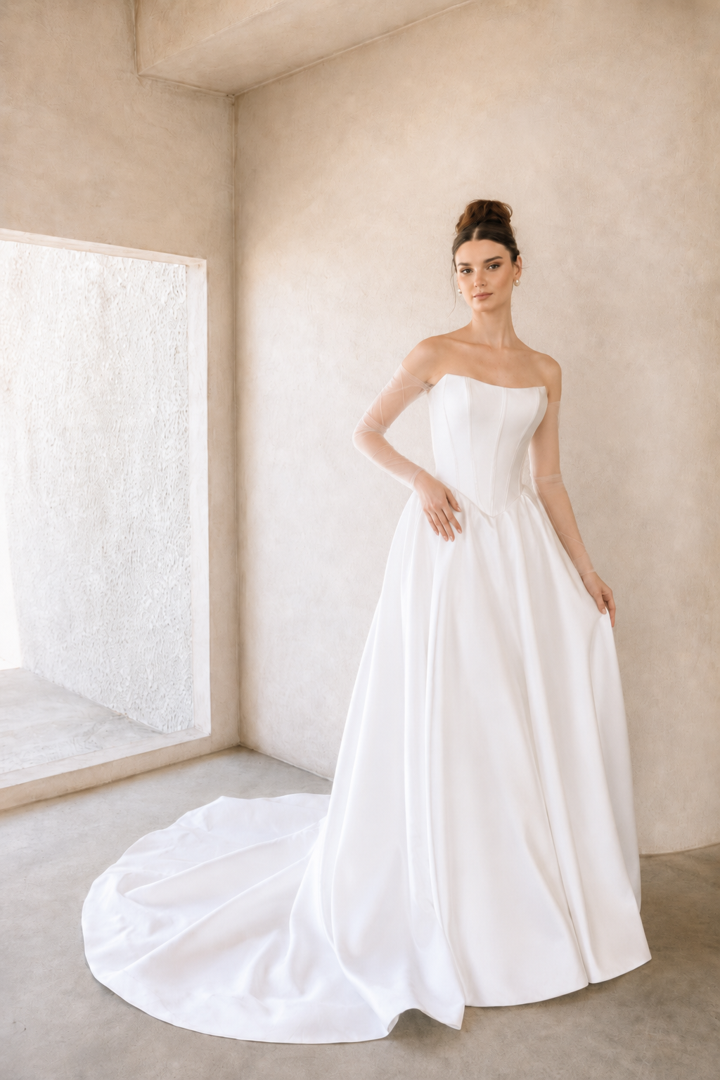 Woman wearing a modern mikado wedding dress in a minimalistic room.
