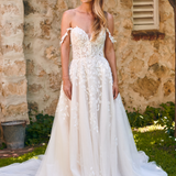 Winona boho tulle A-line wedding dress with beaded bodice and flowing layered skirt.