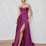 Celine satin A-line formal dress in Magenta with strapless corset bodice and structured flowing skirt.