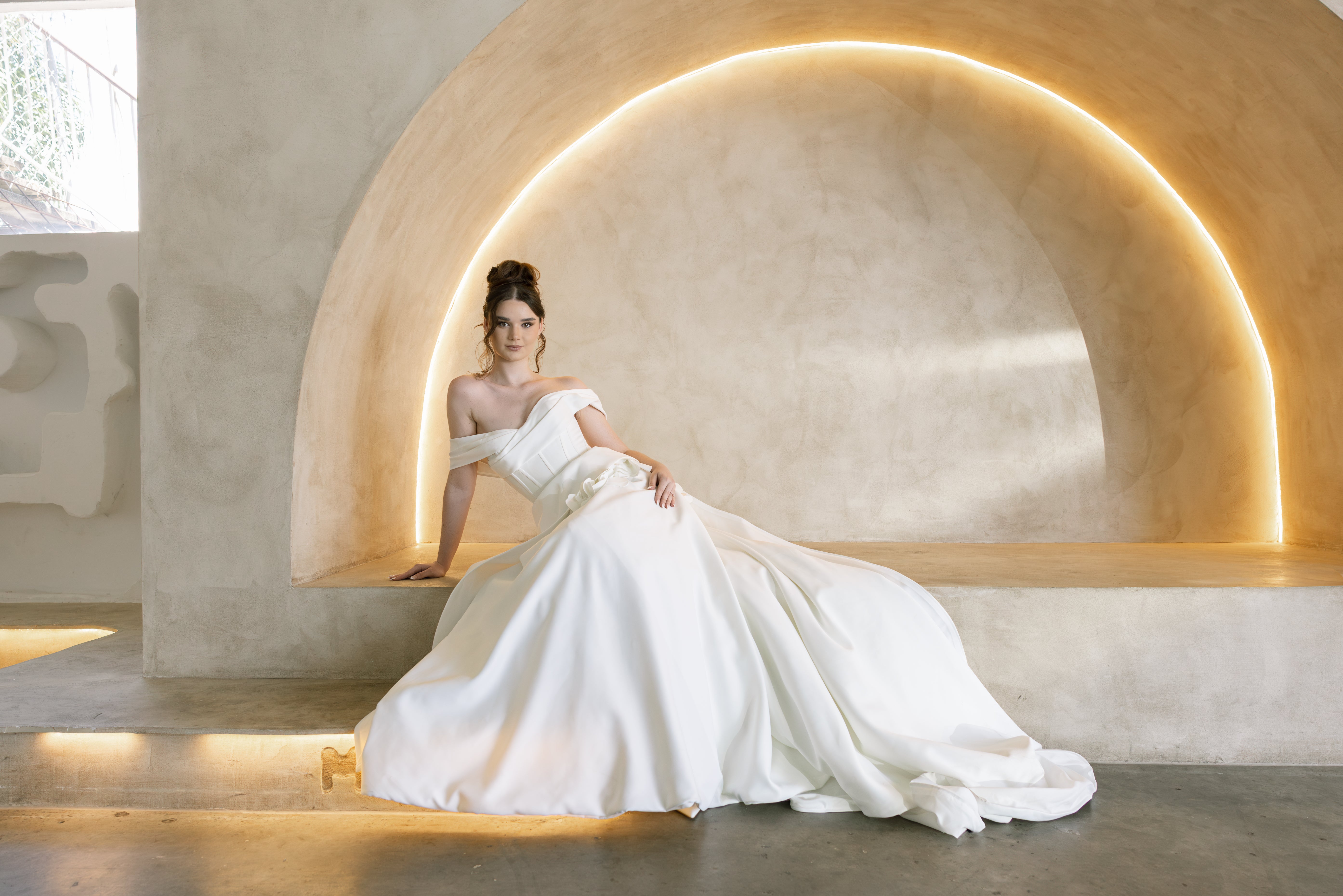 Bride wearing an off-shoulder ball gown wedding dress at After Five Bridal & Formal in Brisbane