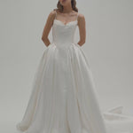 A bride wearing Altrion, a basque waist Mikado ballgown wedding dress.