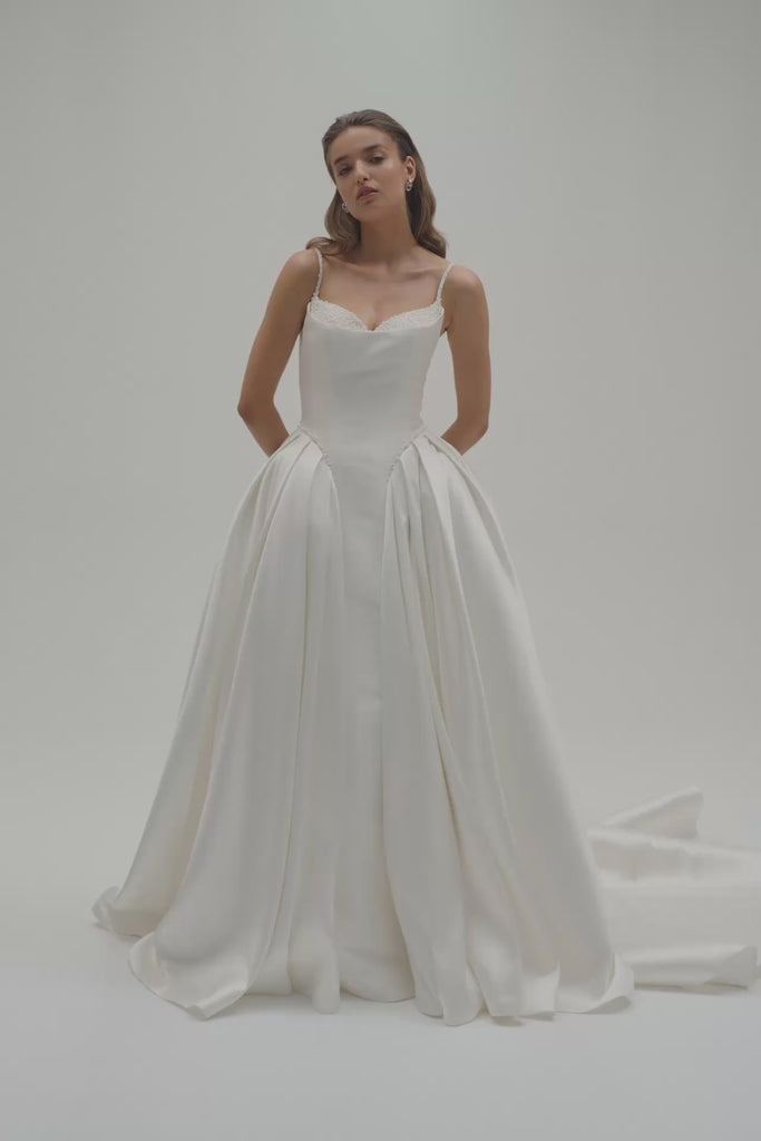 A bride wearing Altrion, a basque waist Mikado ballgown wedding dress.