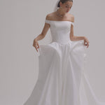 Bride wearing a off-the-shoulder matte satin ballgown wedding dress