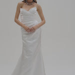 Bride wearing a strapless liquid organza fitted wedding dress