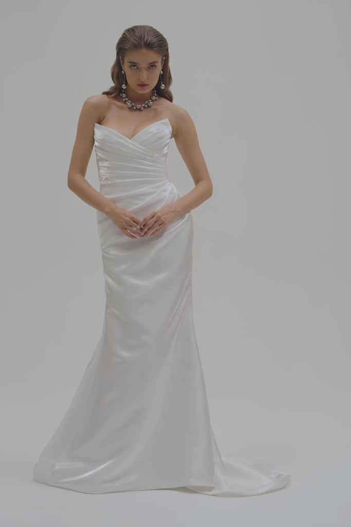 Bride wearing a strapless liquid organza fitted wedding dress